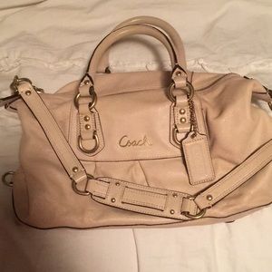 Tan Coach small purse with shoulder strap